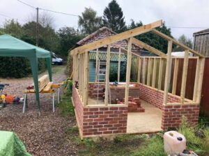 Pump house with brickwork and wooden frame