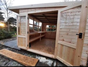 Timber potting shed with doors open